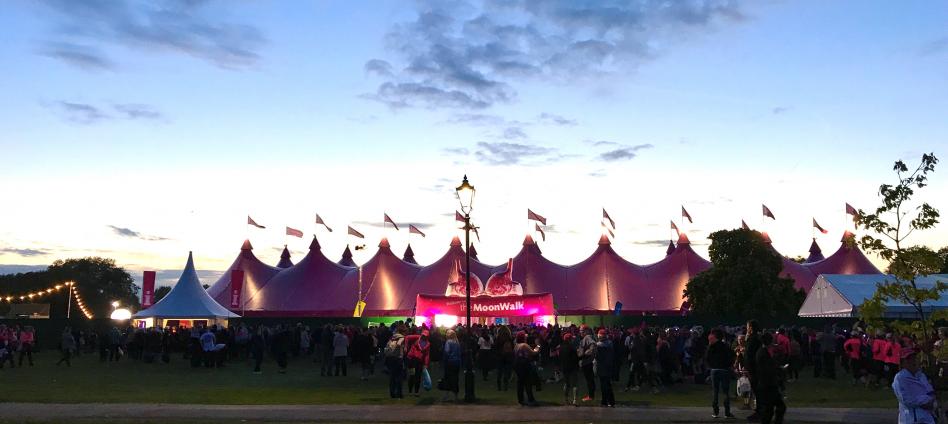 A large Pink Marquee with sunset in the background