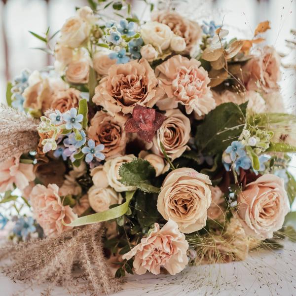 Bouquet of peach and blue flowers 