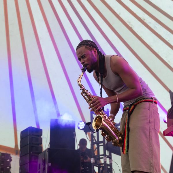 person playing saxophone on stage